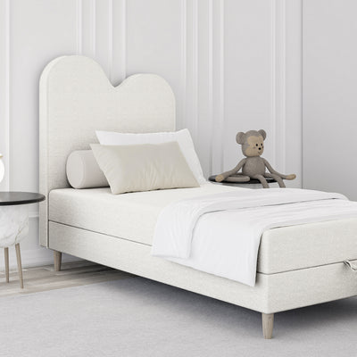 Łóżko dziecięce kontynentalne z falowanym zagłówkiem i pojemnikiem w stylu soft modern | Mellia